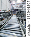packing line in a logistics warehouse. conveyor belt in a modern production line 132944807