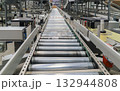 packing line in a logistics warehouse. conveyor belt in a modern production line 132944808