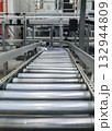 packing line in a logistics warehouse. conveyor belt in a modern production line 132944809