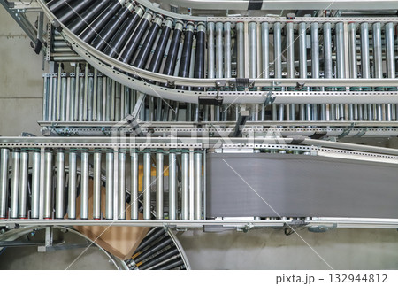 packing line in a logistics warehouse. conveyor belt in a modern production line 132944812