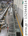 packing line in a logistics warehouse. conveyor belt in a modern production line 132944814