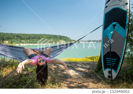 Relaxing in a Hammock by the Lake Relaxing in a Hammock by the Lake 132946002
