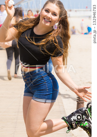 Roller skate woman eating ice cream Roller skate woman eating ice cream 132946783