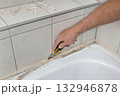 Bathroom renovation, old silicone removal 132946878