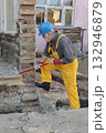 Adult worker demolish old house 132946879