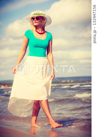 Attractive woman on the beach. Attractive woman on the beach. 132947156
