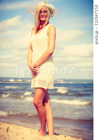 Attractive woman with white dress. Attractive woman with white dress. 132947158