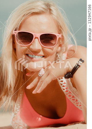 Pretty girl on beach. 132947166