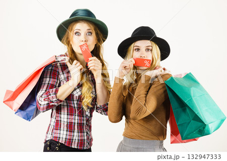 Two woman after sale shopping Two woman after sale shopping 132947333