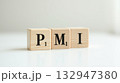 wooden word PMI written in wood block 132947380