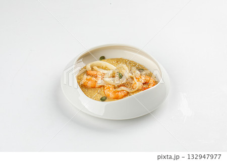 Isolated hummus with shrimp and squid rings 132947977