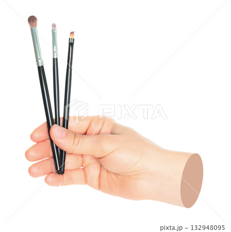 Woman hand holds black cosmetics brush, isolated on transparent background, cosmetics and visage concept. Contemporary art Woman hand holds black cosmetics brush, isolated on transparent background, cosmetics and visage concept. Contemporary art 132948095
