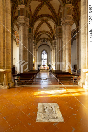 Pienza cathedral nave with rows of pews leading to altar Pienza cathedral nave with rows of pews leading to altar 132948498