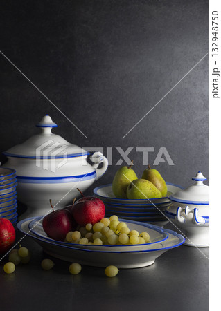 Still life featuring fruit bowls and ceramic tableware 132948750