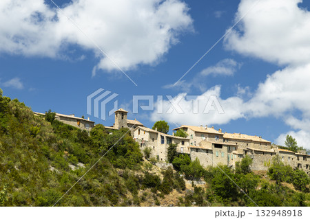 Le Poet Sigillat village with historic stone buildings on hill 132948918