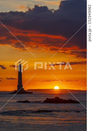 Goury lighthouse guiding ships in La Hague at sunset Goury lighthouse guiding ships in La Hague at sunset 132949062