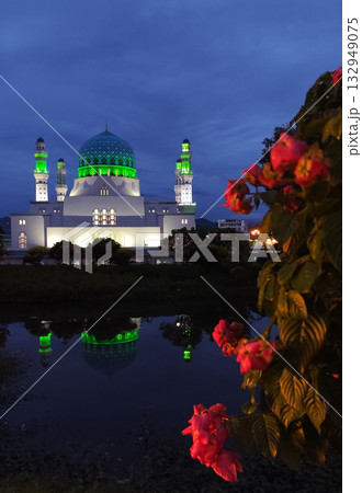 Masjid Bandaraya Kota Kinabalu landmark at dusk with reflection and flowers Masjid Bandaraya Kota Kinabalu landmark at dusk with reflection and flowers 132949075