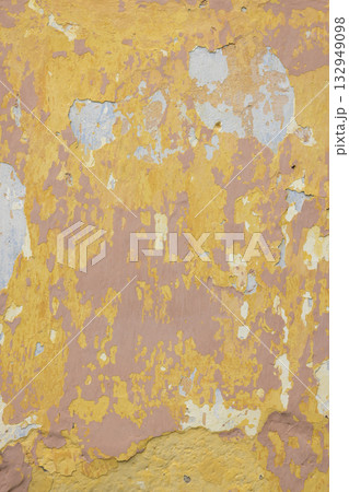 Peeling painted wall showing stucco plaster aging texture 132949098
