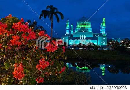 Masjid Bandaraya Kota Kinabalu landmark at dusk with reflection and flowers Masjid Bandaraya Kota Kinabalu landmark at dusk with reflection and flowers 132950068