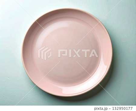 Classic dining. Ceramic plate with a classic pink design on a white background. Porcelain kitchenware. Close-up. Top view. 132950177