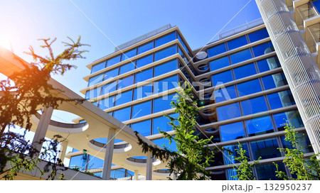 Exterior of modern high-rise buildings in a business district. Tall office buildings. Glass-fronted skyscrapers. Modern business district. 132950237