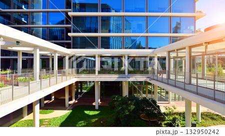 Exterior of modern high-rise buildings in a business district. Tall office buildings. Glass-fronted skyscrapers. Modern business district. 132950242
