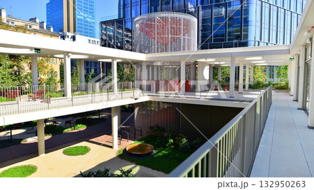 Exterior of modern high-rise buildings in a business district. Tall office buildings. Glass-fronted skyscrapers. Modern business district. Exterior of modern high-rise buildings in a business district. Tall office buildings. Glass-fronted skyscrapers. Modern business district. 132950263