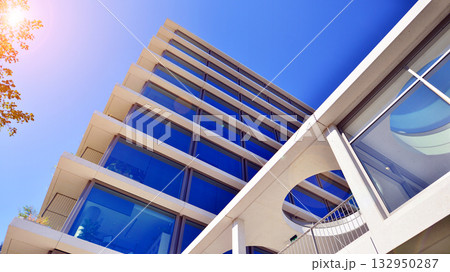 Exterior of modern high-rise buildings in a business district. Tall office buildings. Glass-fronted skyscrapers. Modern business district. 132950287