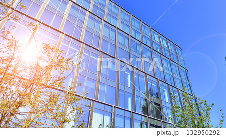 Exterior of modern high-rise buildings in a business district. Tall office buildings. Glass-fronted skyscrapers. Modern business district. 132950292