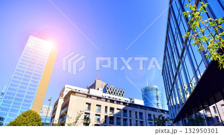 Exterior of modern high-rise buildings in a business district. Tall office buildings. Glass-fronted skyscrapers. Modern business district. Exterior of modern high-rise buildings in a business district. Tall office buildings. Glass-fronted skyscrapers. Modern business district. 132950301