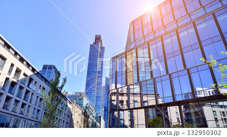 Exterior of modern high-rise buildings in a business district. Tall office buildings. Glass-fronted skyscrapers. Modern business district. Exterior of modern high-rise buildings in a business district. Tall office buildings. Glass-fronted skyscrapers. Modern business district. 132950302