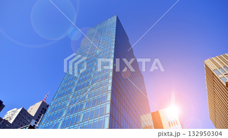 Exterior of modern high-rise buildings in a business district. Tall office buildings. Glass-fronted skyscrapers. Modern business district. 132950304