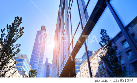 Exterior of modern high-rise buildings in a business district. Tall office buildings. Glass-fronted skyscrapers. Modern business district. 132951074