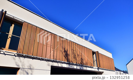Newly built terraced houses in a residential area. Modern terraced houses on the outskirts of the city. Newly built terraced houses in a residential area. Modern terraced houses on the outskirts of the city. 132951258