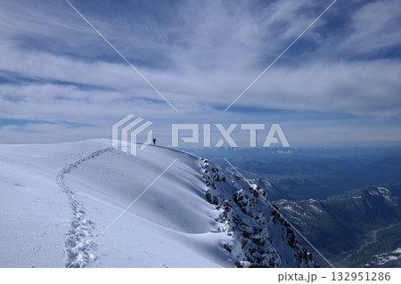 Tranquil Lake With Lush Green Forest, Snow-Capped Mountain, Blue Sky And White Clouds Tranquil Lake With Lush Green Forest, Snow-Capped Mountain, Blue Sky And White Clouds 132951286