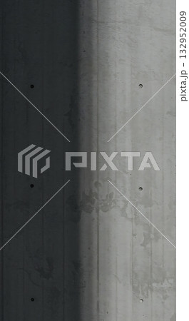 Stunning modern concrete texture background with dramatic shadow and subtle imperfections, perfect for architectural design and industrial themes. 132952009