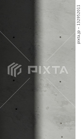 Modern concrete texture with dramatic shadow play, offering a stark, sophisticated backdrop for architectural or design concepts. 132952011