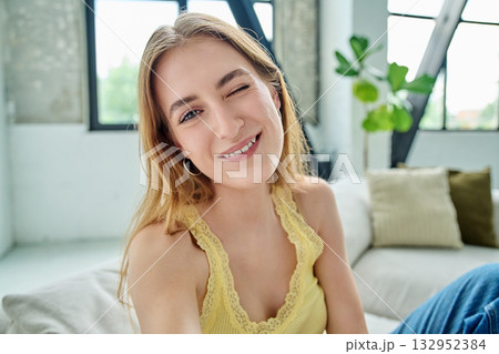 Close-up selfie portrait of teenage female looking at web camera Close-up selfie portrait of teenage female looking at web camera 132952384