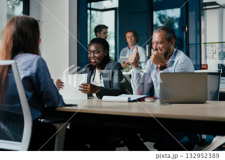 Diverse Business Team Meeting in Modern Glass Office Diverse Business Team Meeting in Modern Glass Office 132952389
