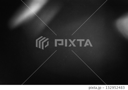 Black and white grainy film texture with faded light leaks and dusty surface Black and white grainy film texture with faded light leaks and dusty surface 132952483