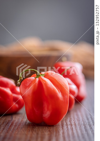 Red chili pepper habanero on wooden table. 132952757