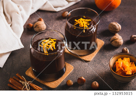 Autumn chocolate pumpkin dessert in glasses on the table Autumn chocolate pumpkin dessert in glasses on the table 132953015