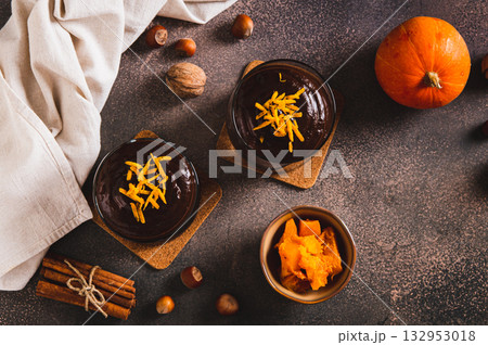 Chocolate pumpkin mousse with orange zest in glasses on the table top view Chocolate pumpkin mousse with orange zest in glasses on the table top view 132953018