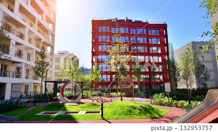 European residential architecture harmonizing with nature. Eco-friendly living in city with greens. Eco apartment building saving energy and fresh air concept.  132953757
