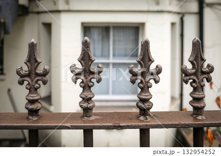 Ornamental Metal Fence Detail in Front of Building Ornamental Metal Fence Detail in Front of Building 132954252