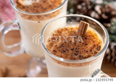 Eggnog with Cinnamon and Christmas Decorations 132955749