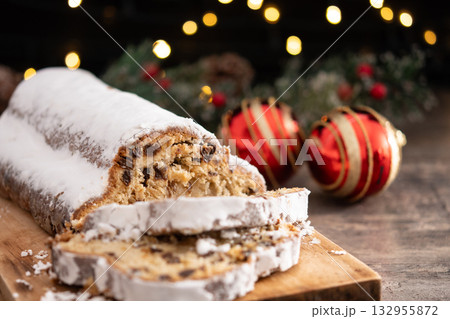 Traditional Christmas Stollen with Raisins on christmas background 132955872