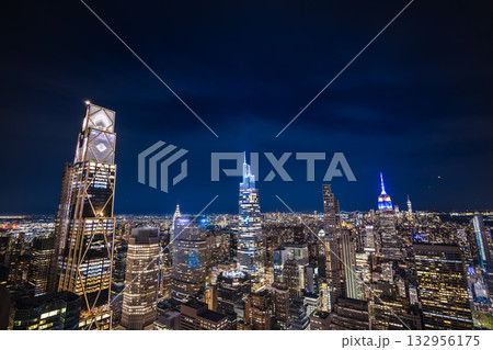 Night aerial view of illuminated Manhattan skyscrapers 132956175