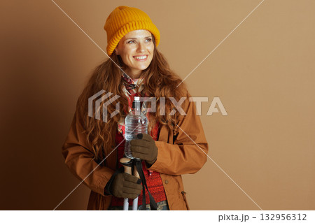 Anticipating Adventure: Hiker in Yellow Beanie 132956312