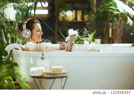 Blissful Bubble Bath with Headphones and Tablet 132956397